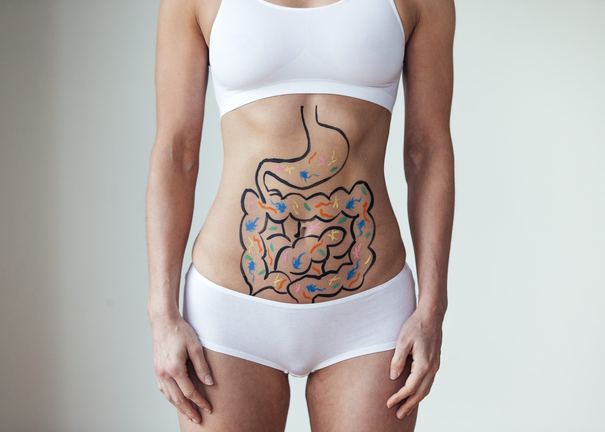 Woman with an illustration on her stomach of her intestines