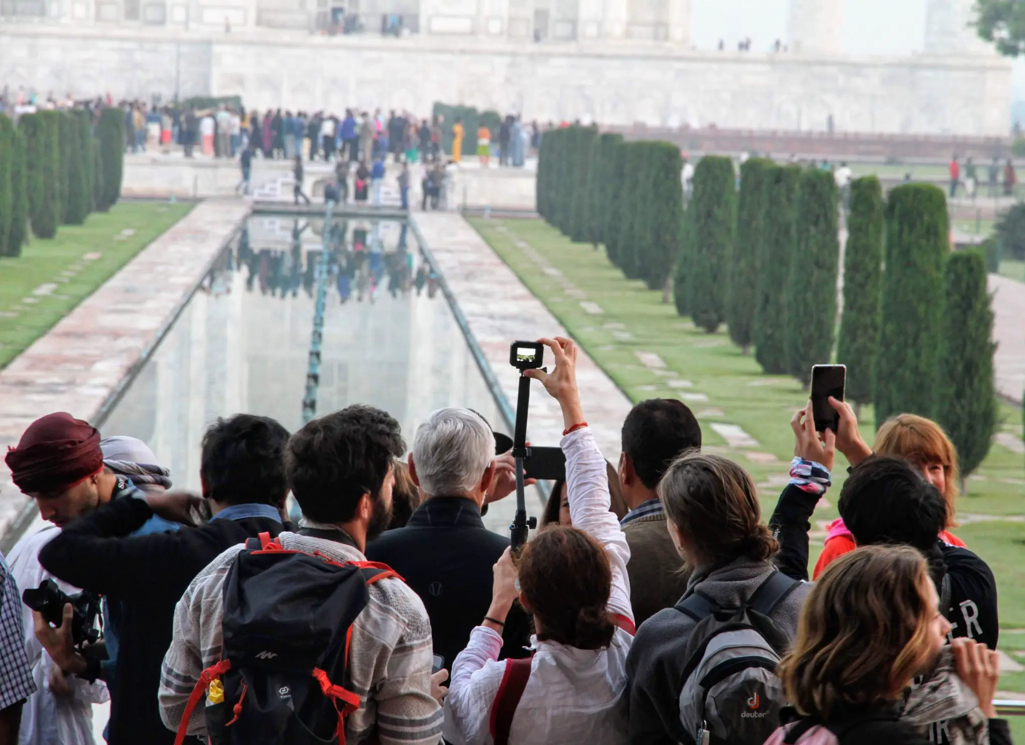 Selfie sticks in front of the Taj Mahal