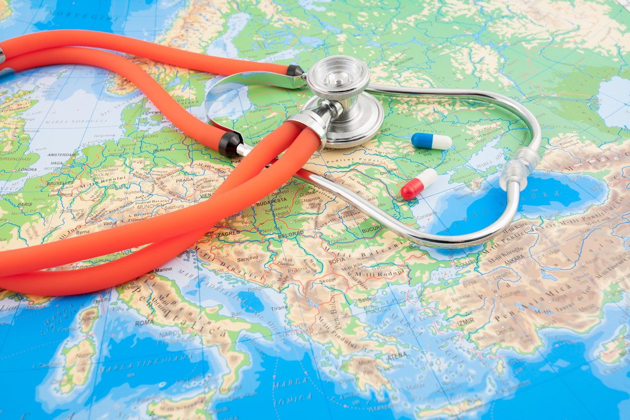 Map, pills and stethoscope. iStock