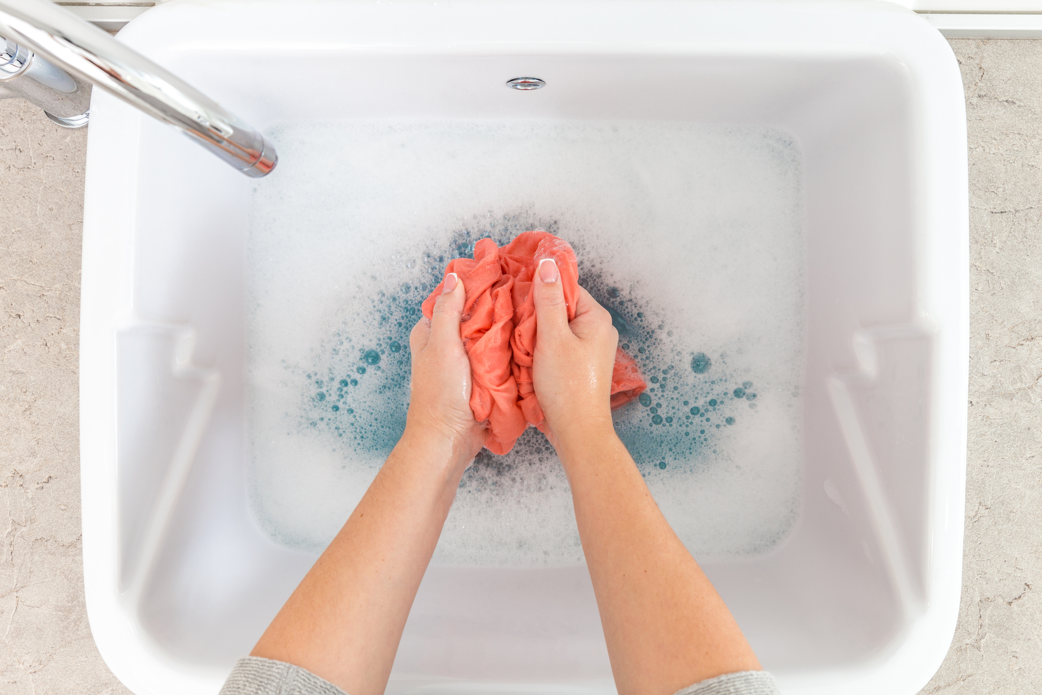 Washing clothes in the sink