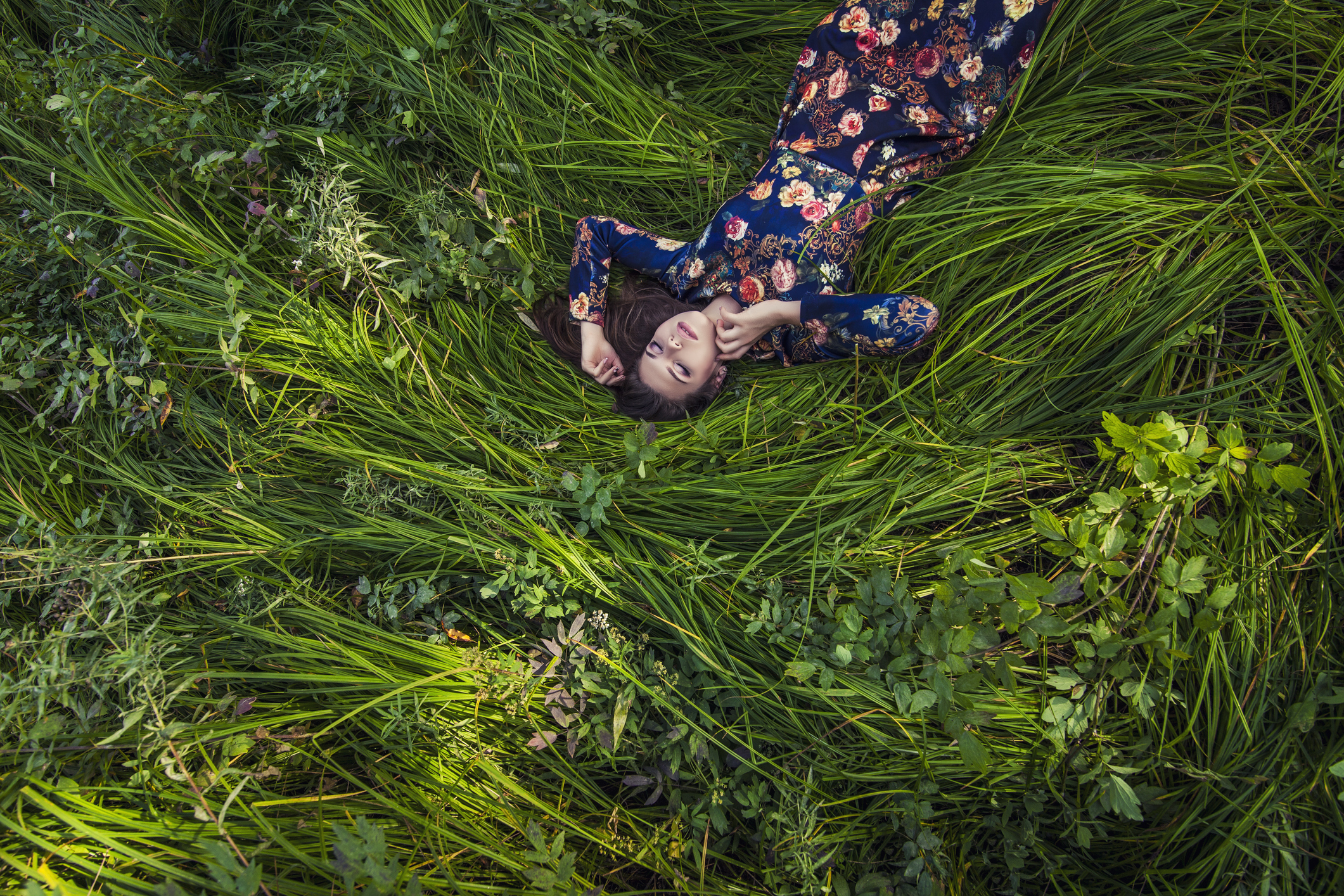 Woman relaxes in the grass