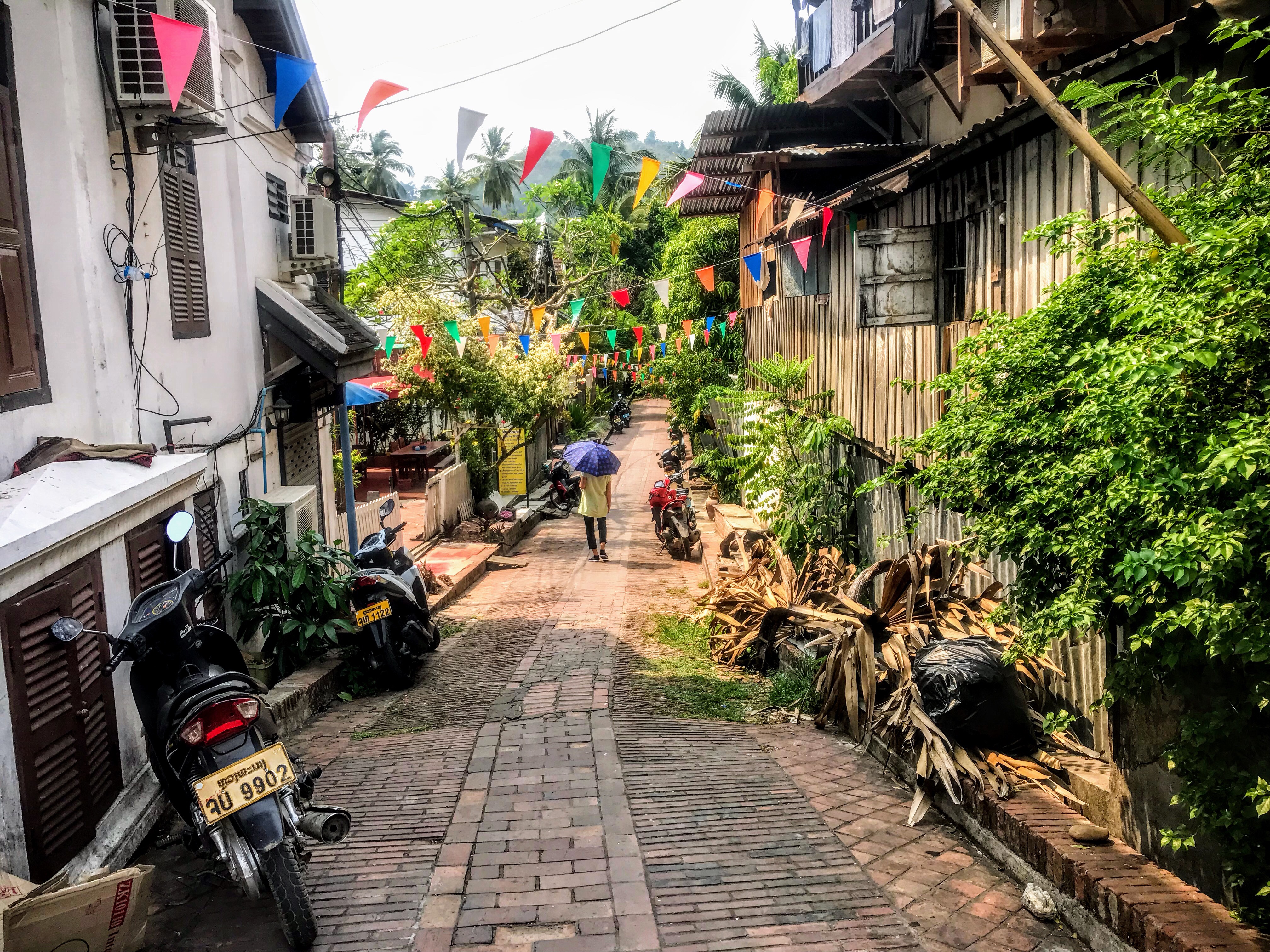 Woman walking through the streets of Luang Prabang, Laos