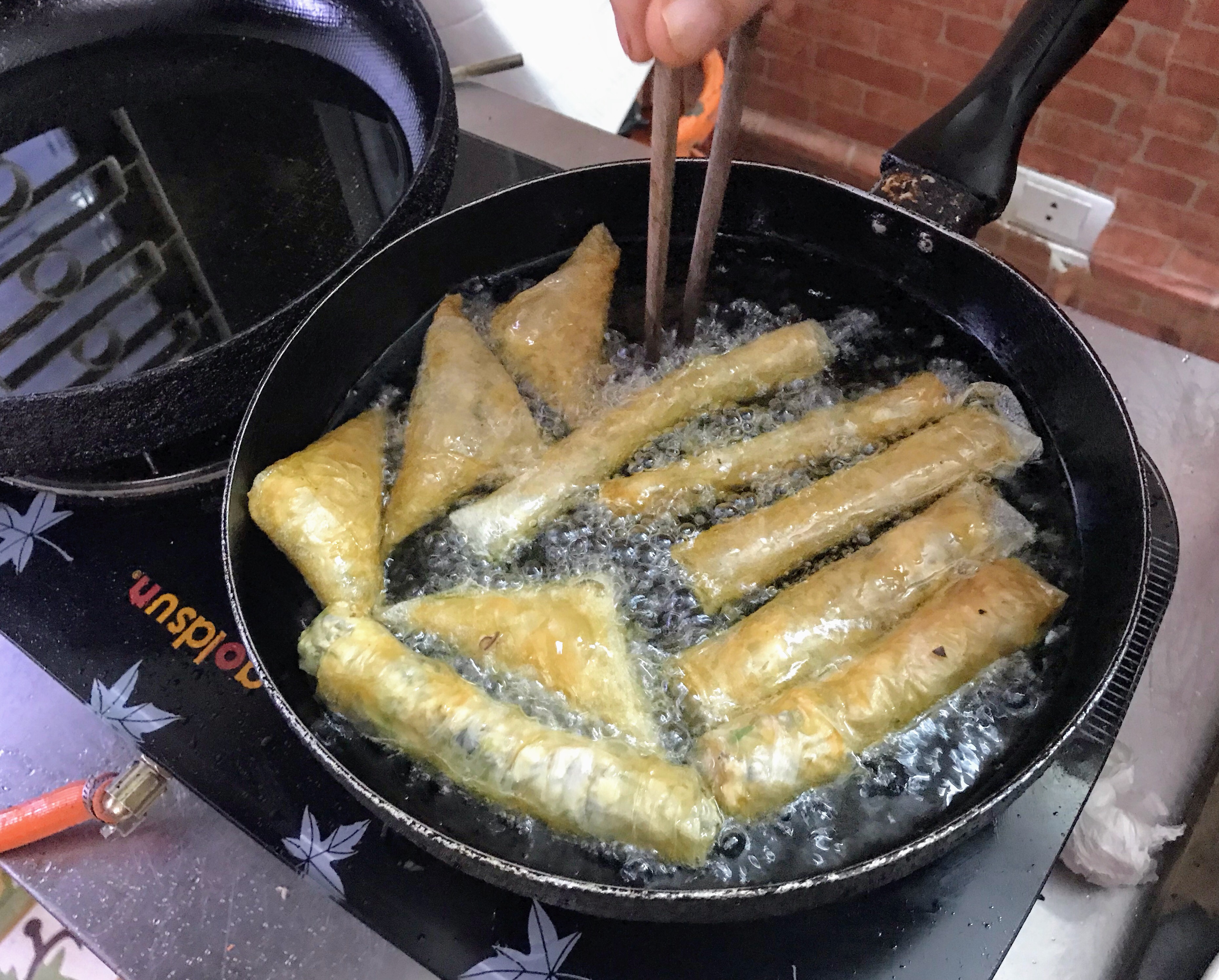 Frying spring rolls, Hanoi, Vietnam 