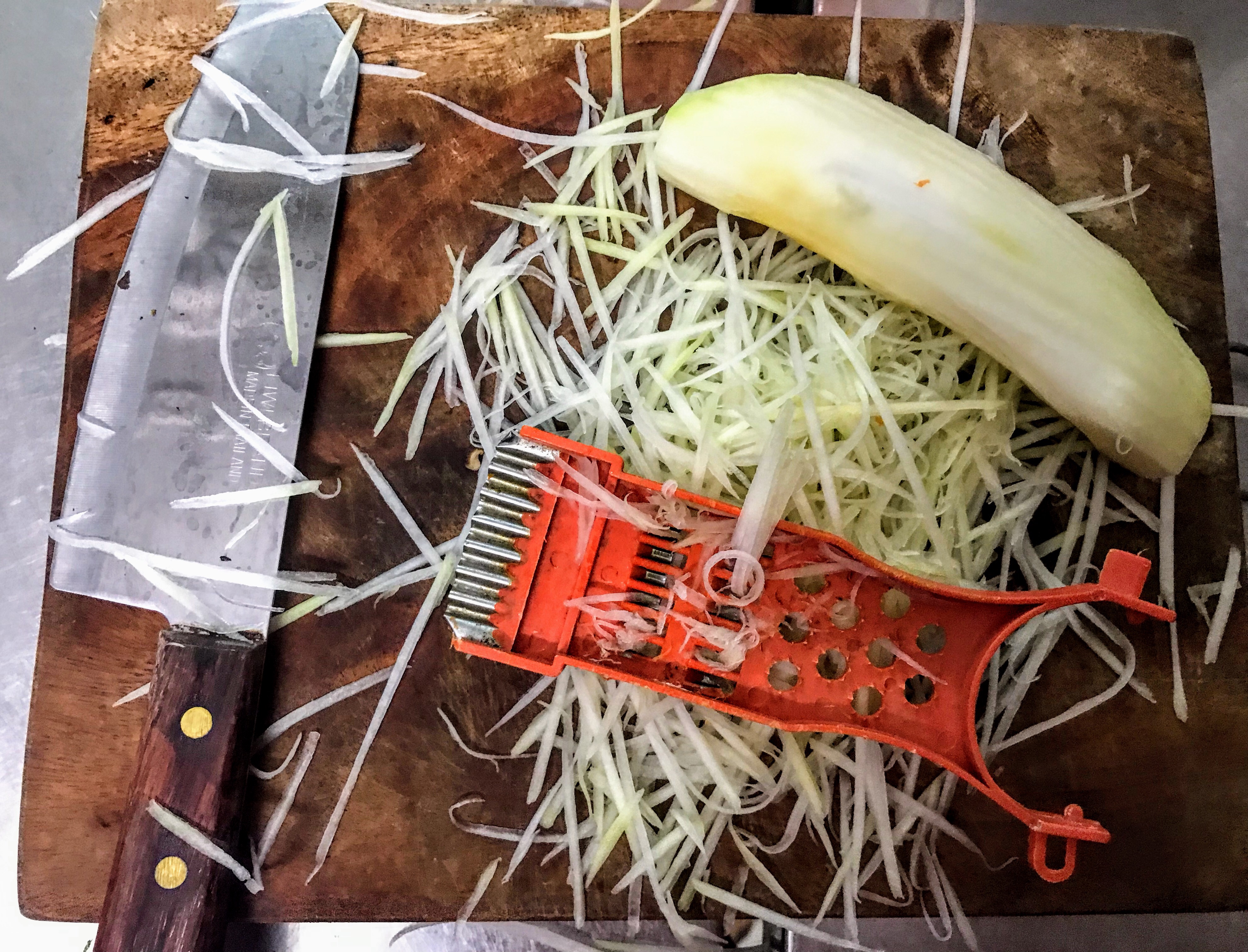 Making green papaya salad, Hanoi, Vietnam 