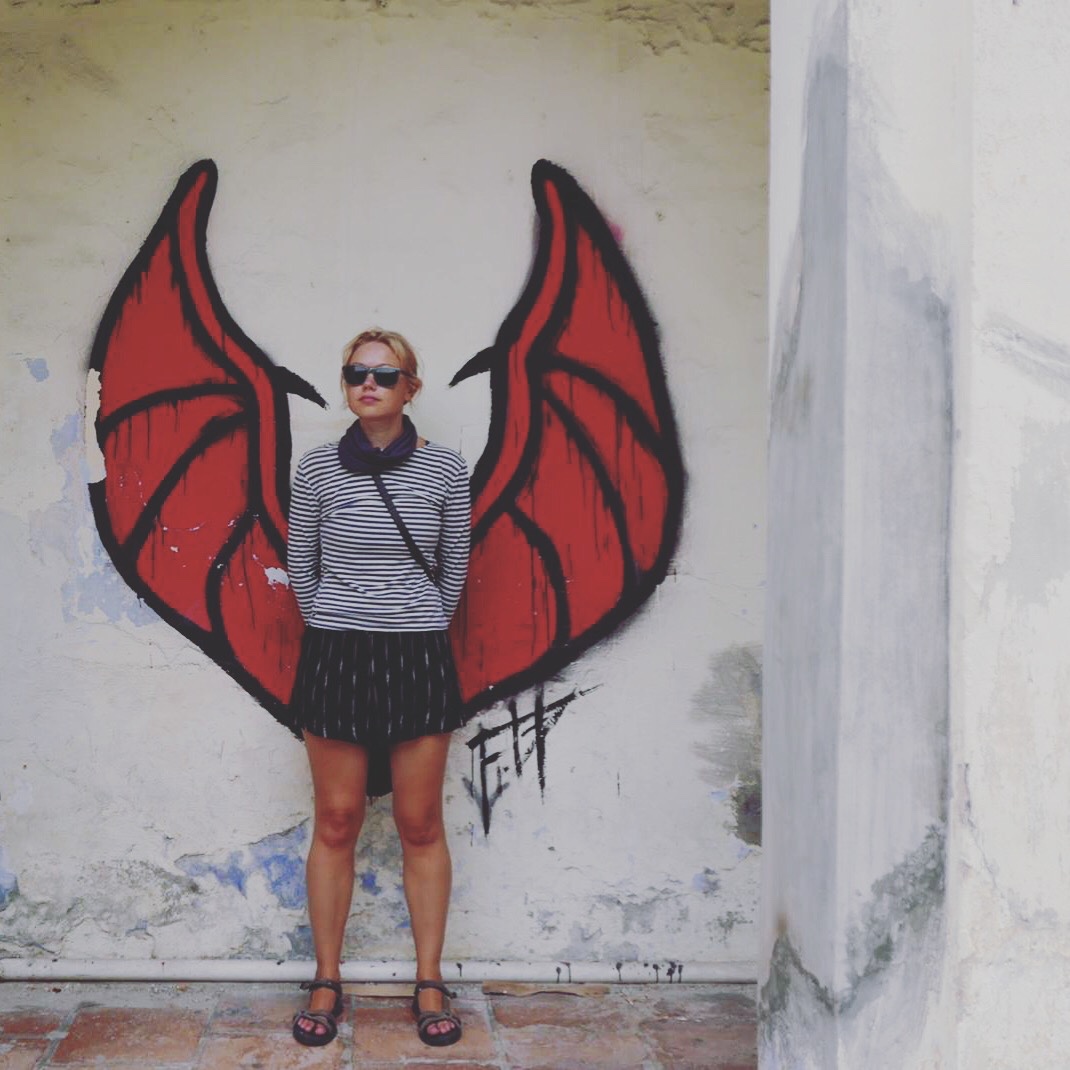 Posing with bat wings, George Town, Malaysia 