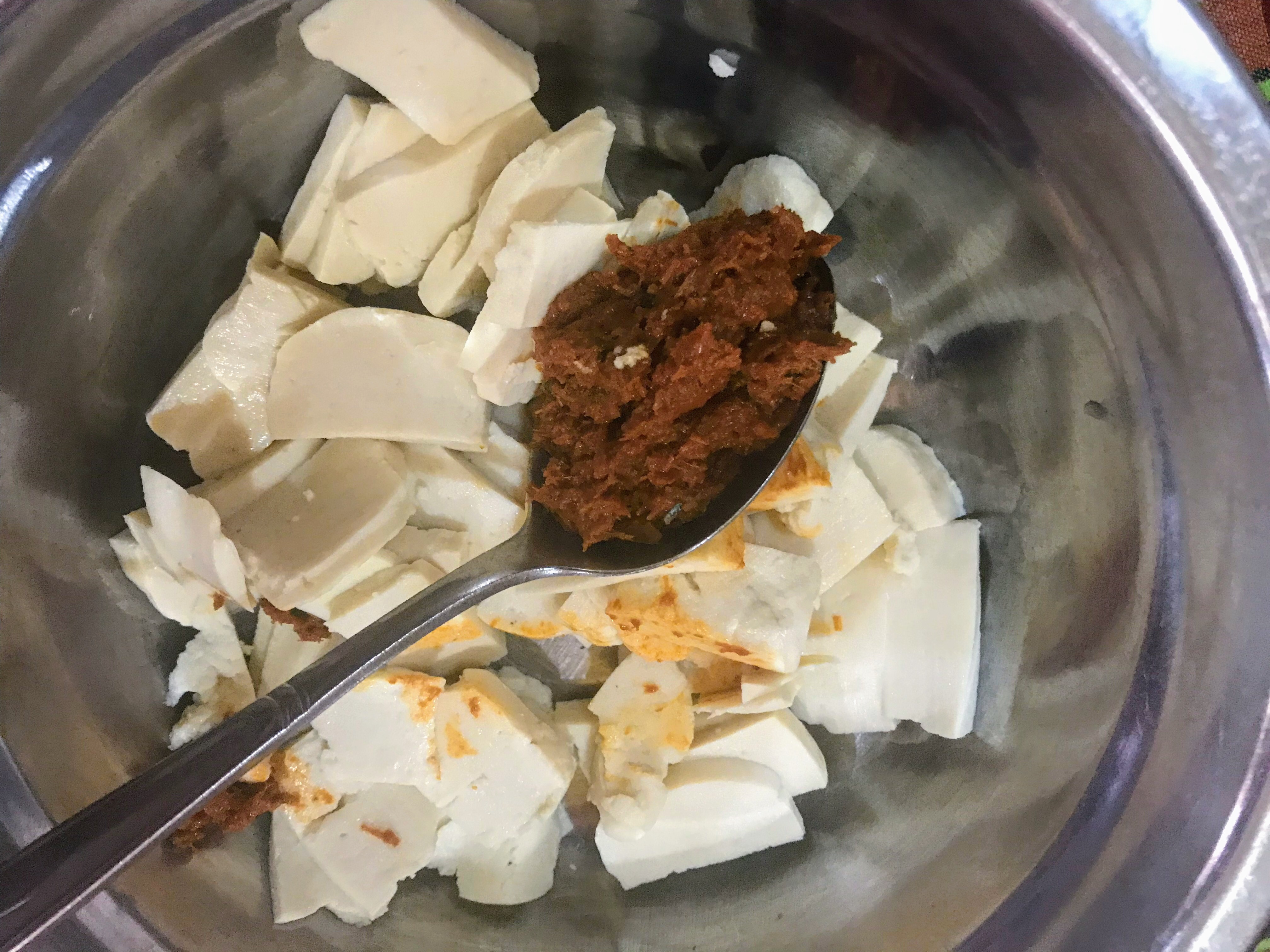 Marinating tofu with paste, Battambang, Cambodia 