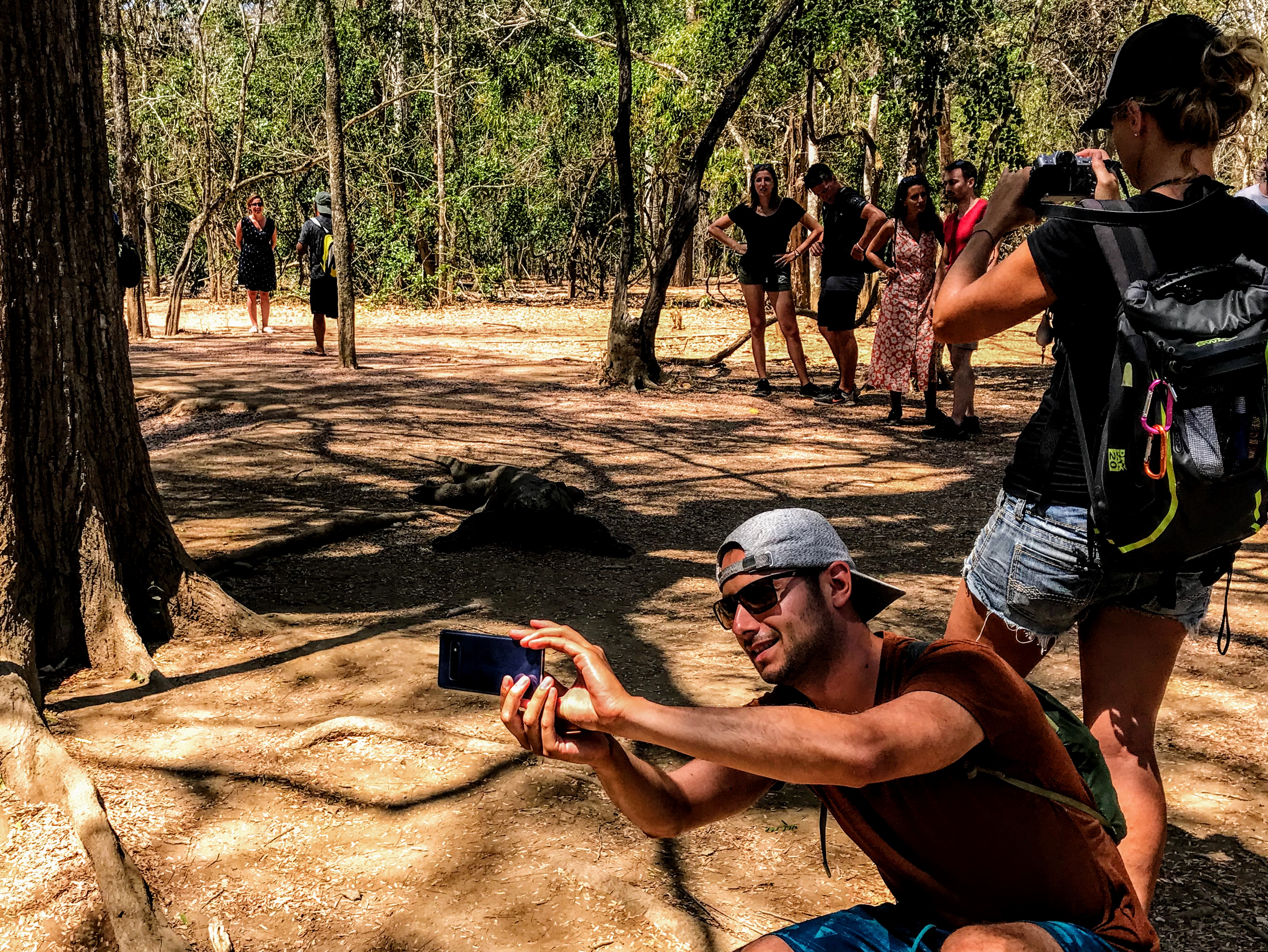 Tourist taking a selfie with a Komodo Dragon, Indonesia