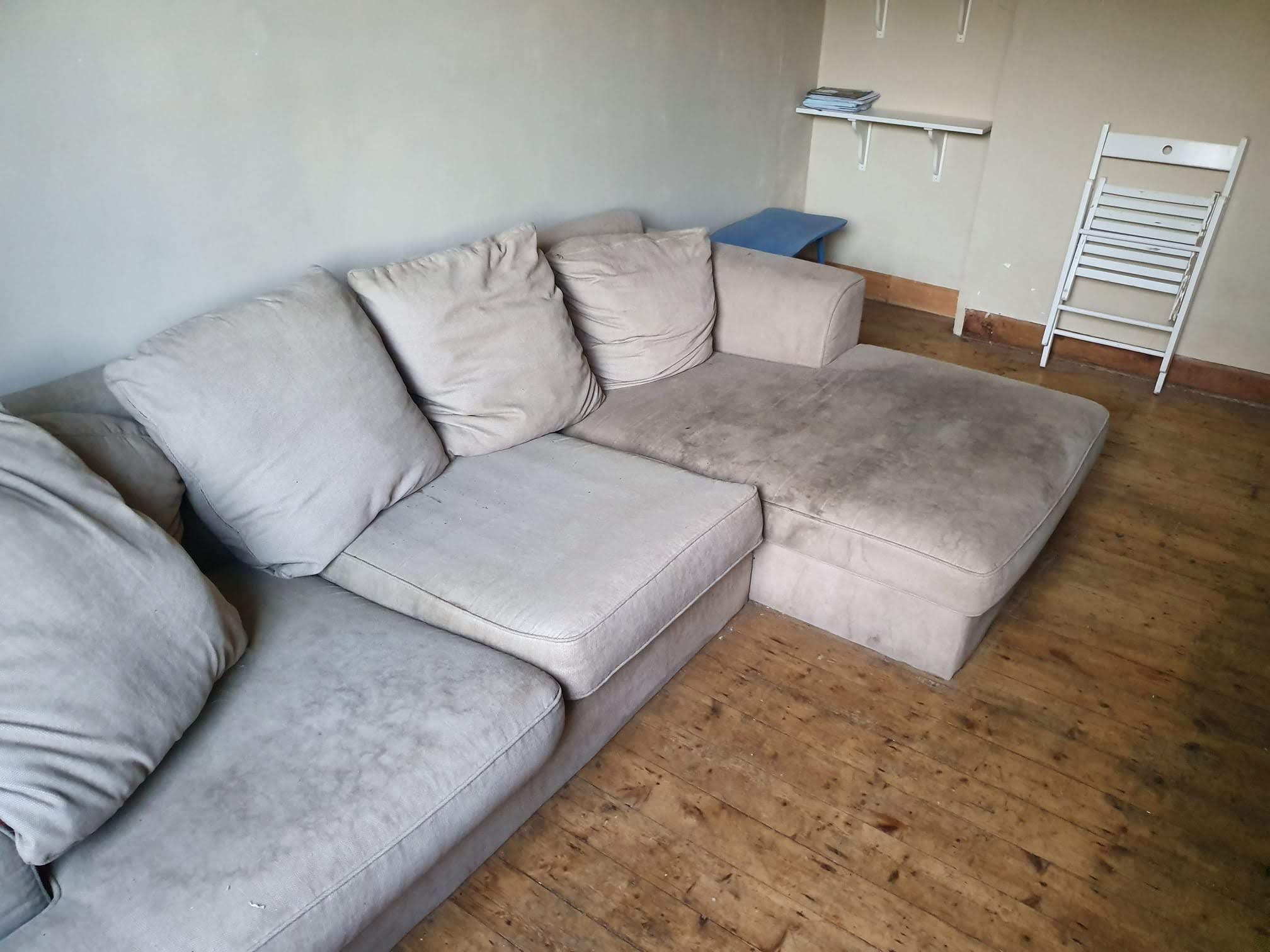 Before: Stained beige sofa