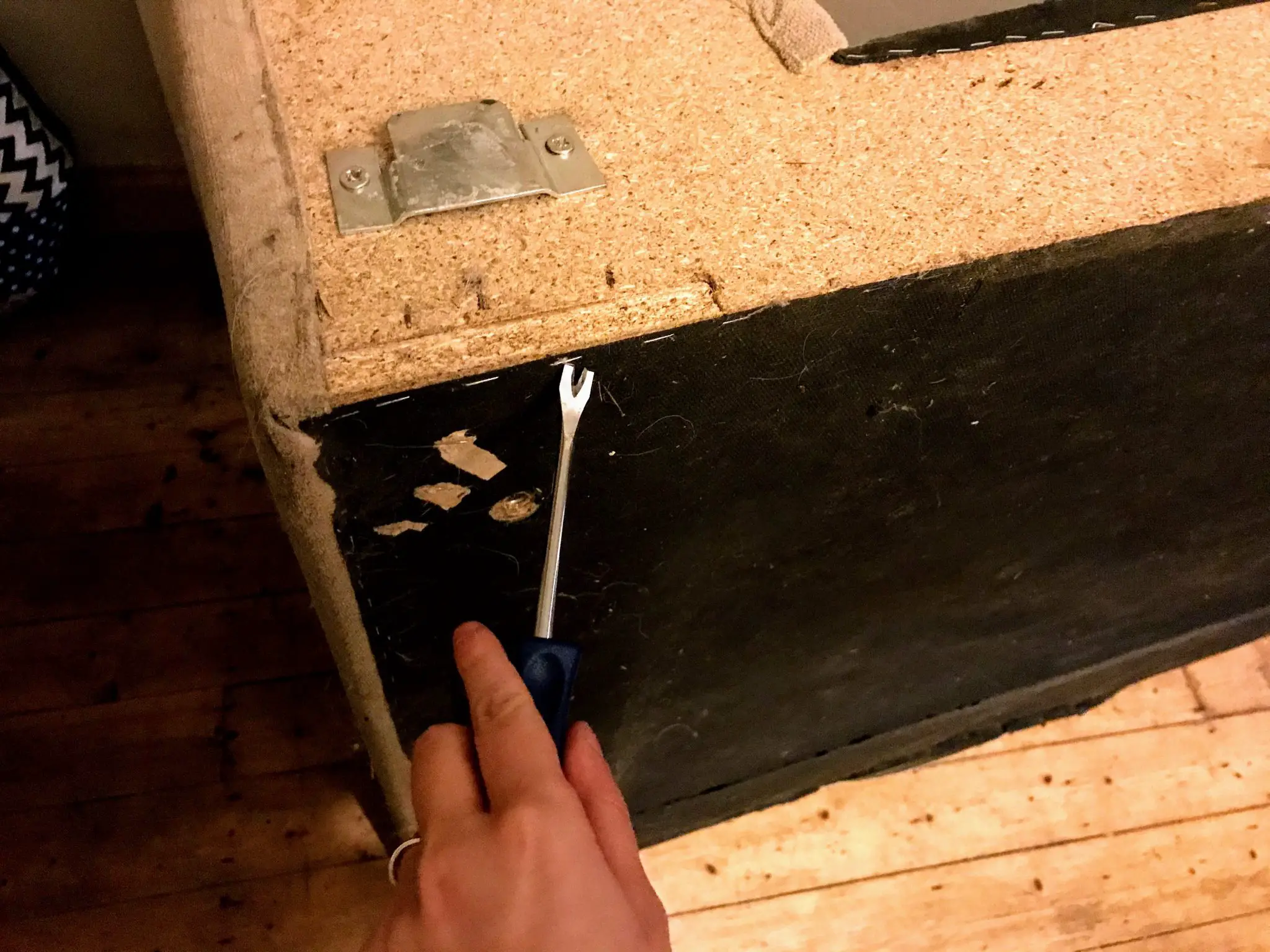 Removing staples from sofa 