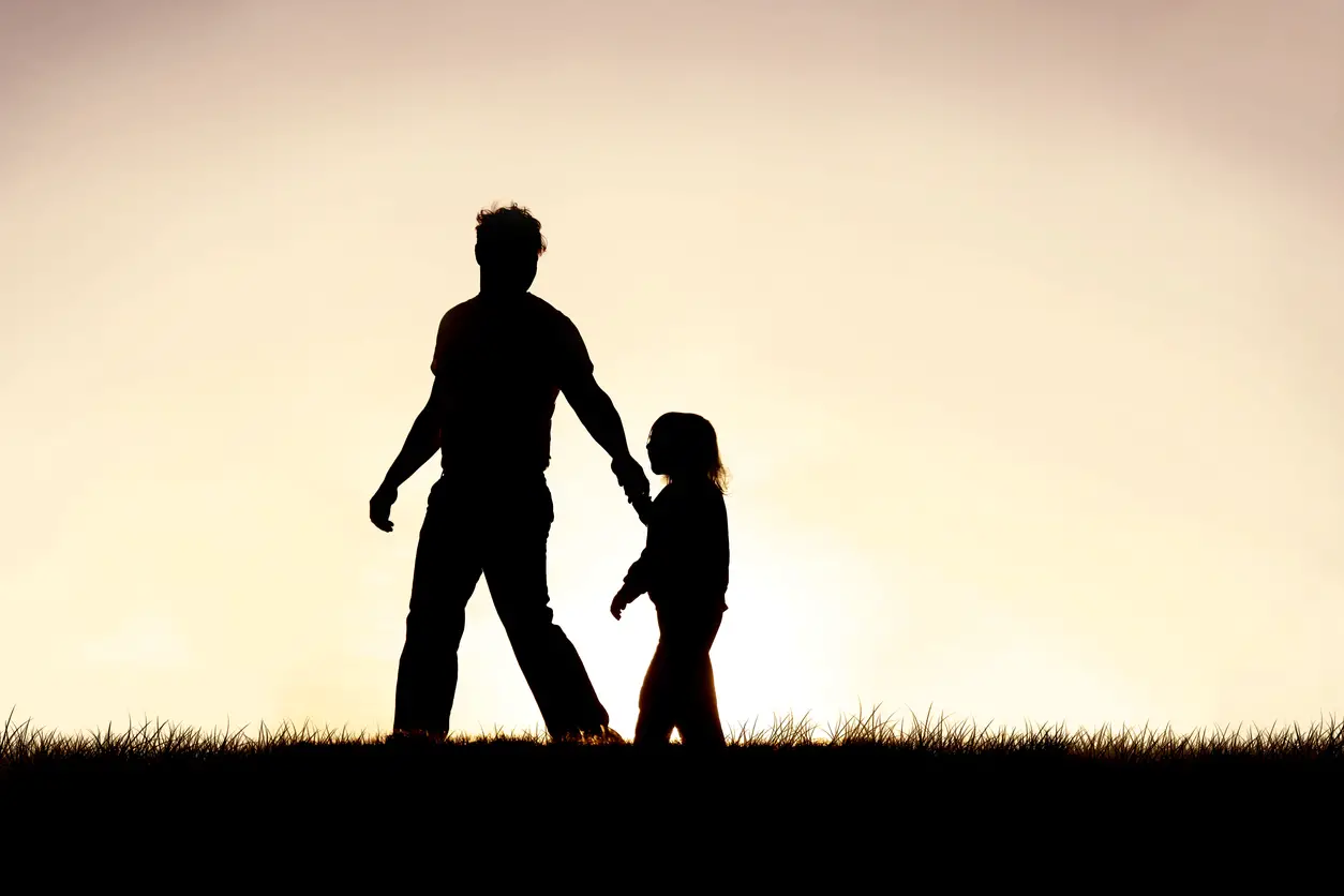Father and child in silhouette