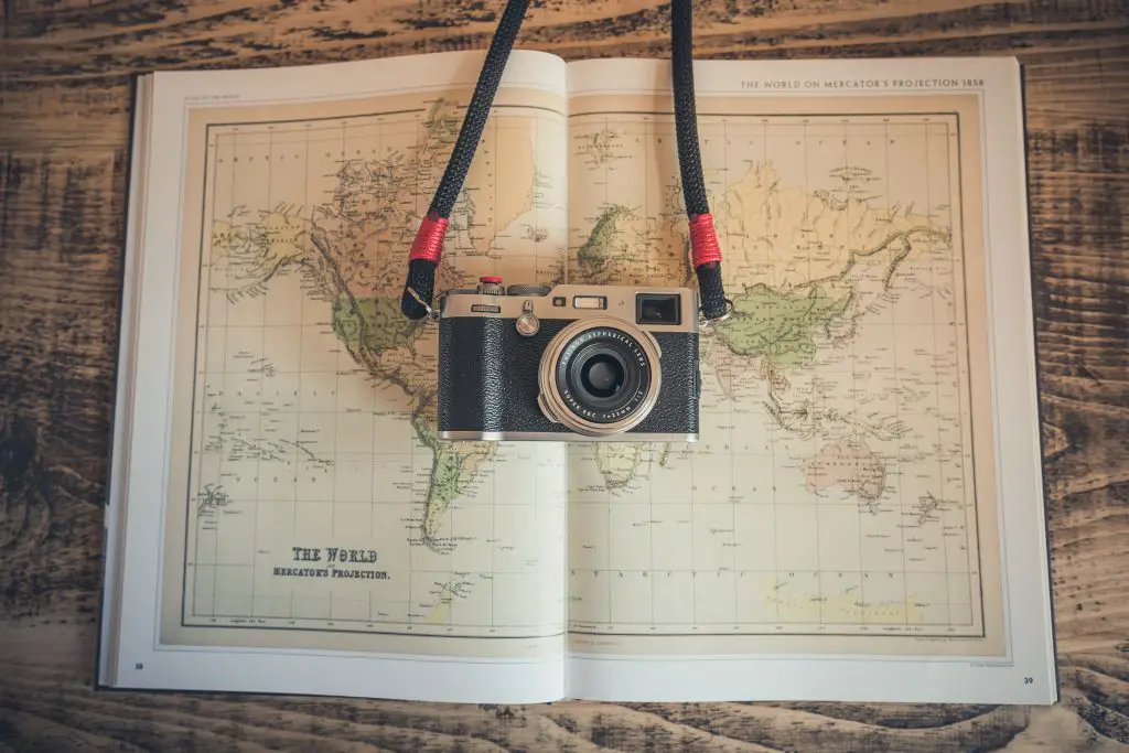 Camera and vintage map. Photo by Chris Lawton on Unsplash