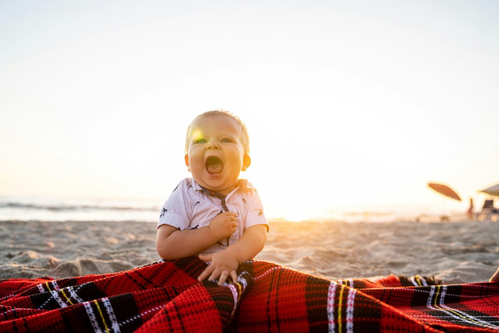 Baby boy at the beach. Photo by Matt Howard on Unsplash